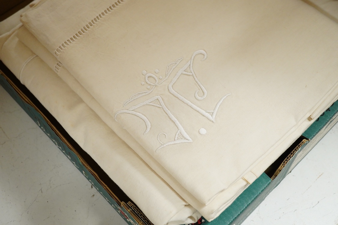 Seven French provincial coarse linen sheets, with a drawn thread bordered large white monogrammed turn backs